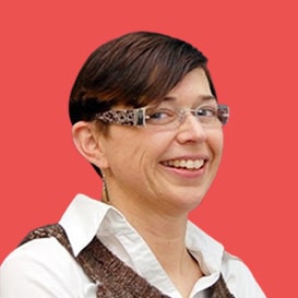 Confident aged businesswoman wearing glasses, a skilled and experienced senior female professional. A mature lady teacher and coach posing alone in the office, representing the image of a capable older woman boss in a headshot. Relevant for individuals seeking guidance and insights from a dissertation expert.